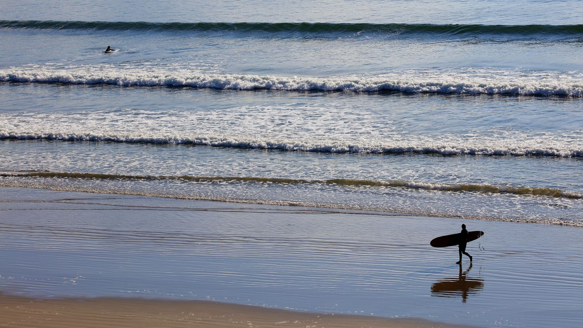 Surfer walking inch strand dingle peninsula co kerry banner www.therosehotel.com_v3